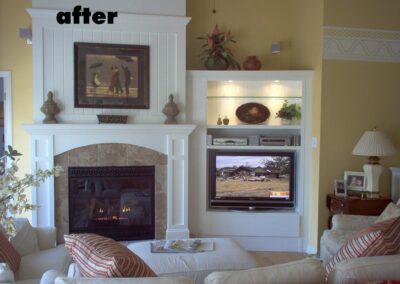 new fireplace construction after with stone surround and white wood mantel