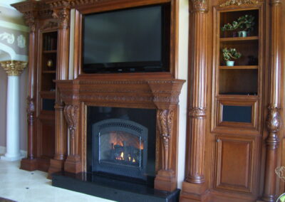 new gas fireplace in living room with wooden mantel and surround
