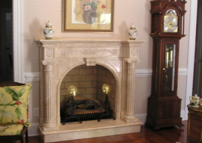 new gas fireplace in living room with marble surround and mantel