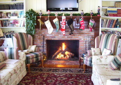 new gas fireplace in living room with brick fireplace