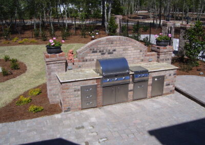 outdoor kitchen on back porch with built-in grill after