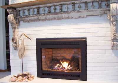 new gas fireplace in living room with white brick surround