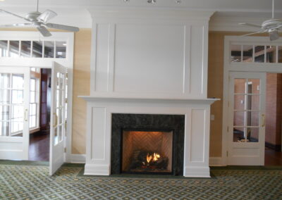 custom white wood surround with gas fireplace