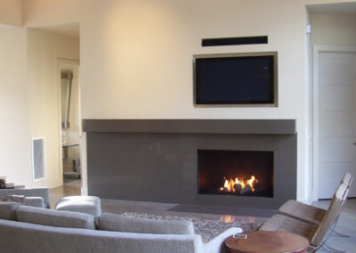 gas fireplace with stone surround in living room