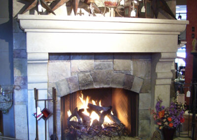 gas fireplace with stone and white wood surround